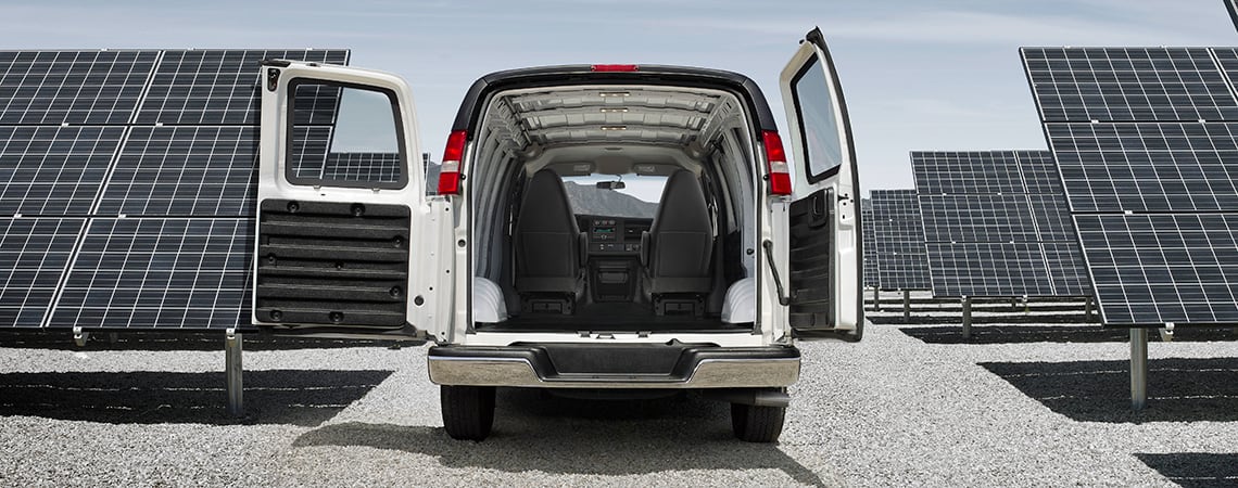 2023 GMC Savana Cargo Van with rear doors open showing maximum cargo space